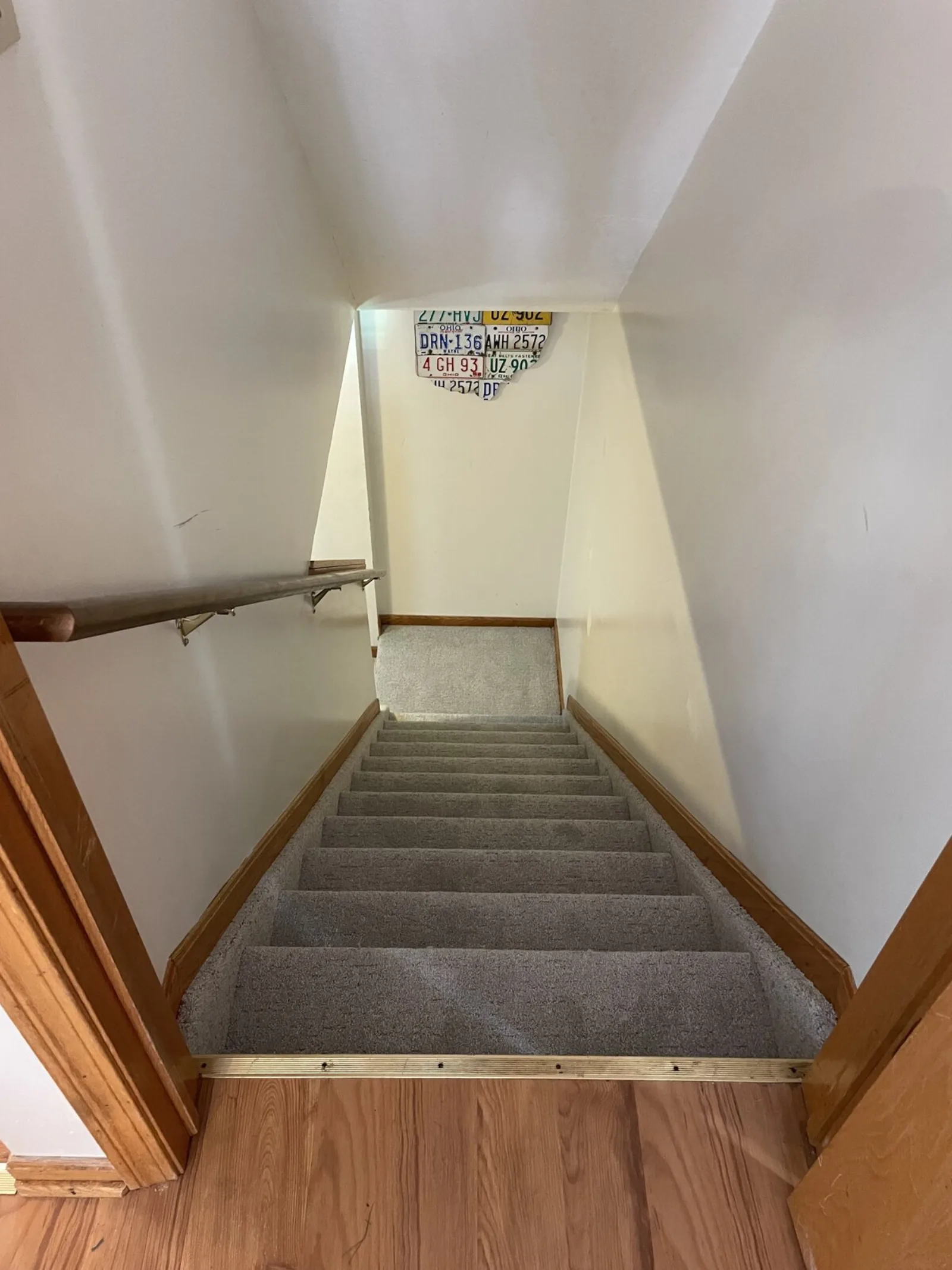 Carpeted staircase and landing
