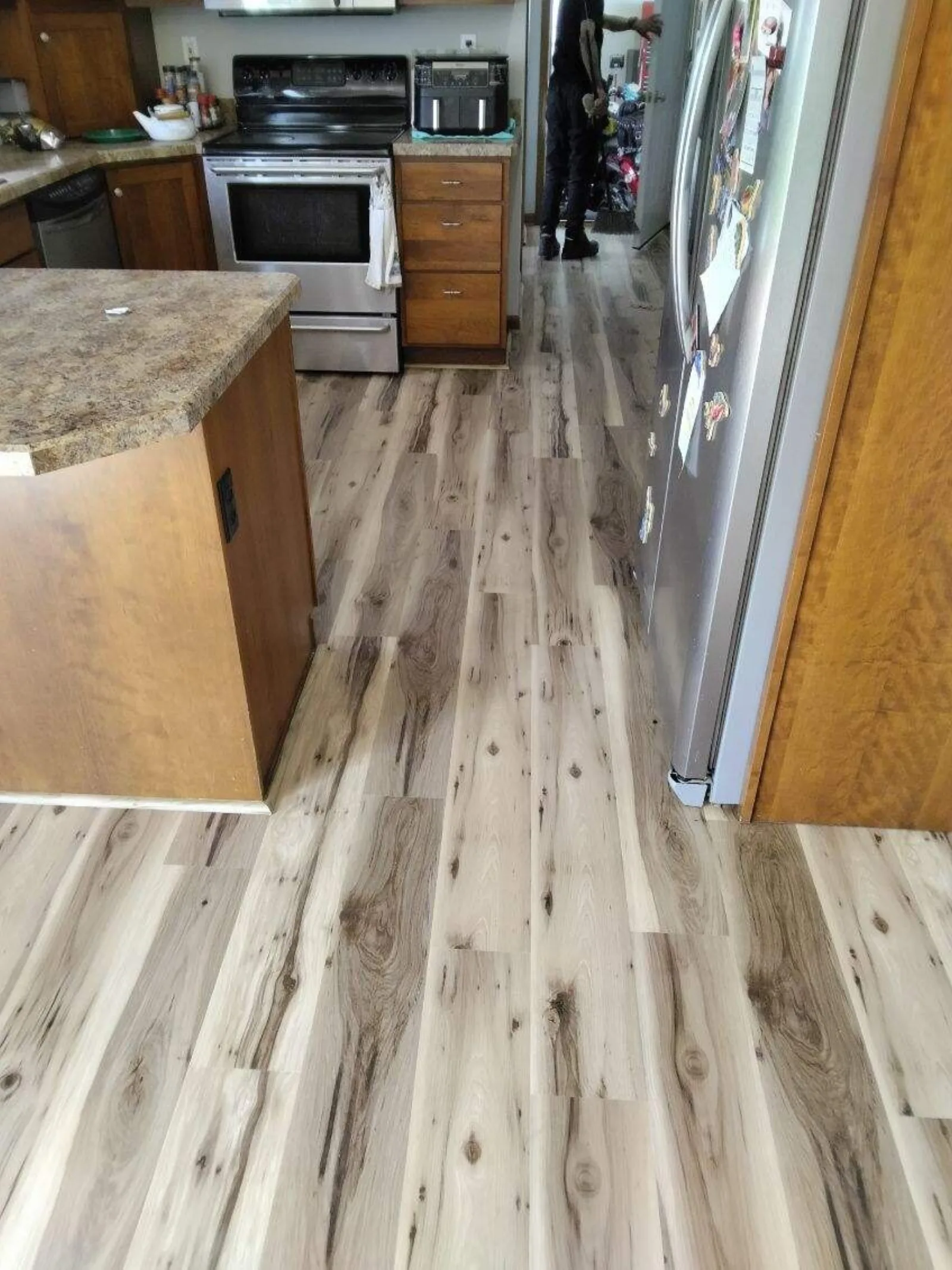 Light luxury vinyl plank kitchen floor