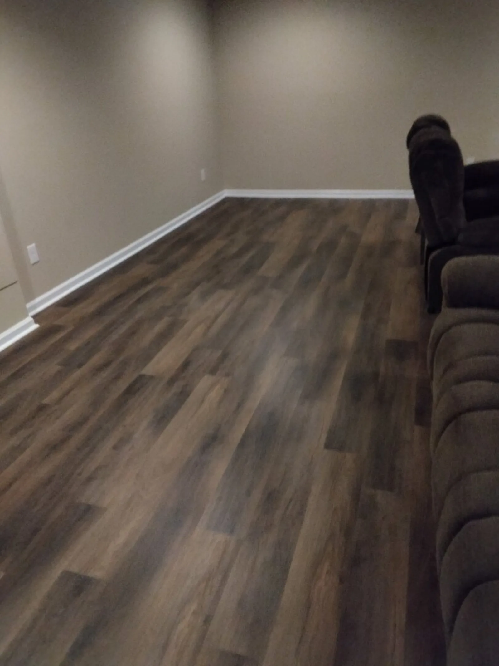 Open-concept luxury vinyl plank living room