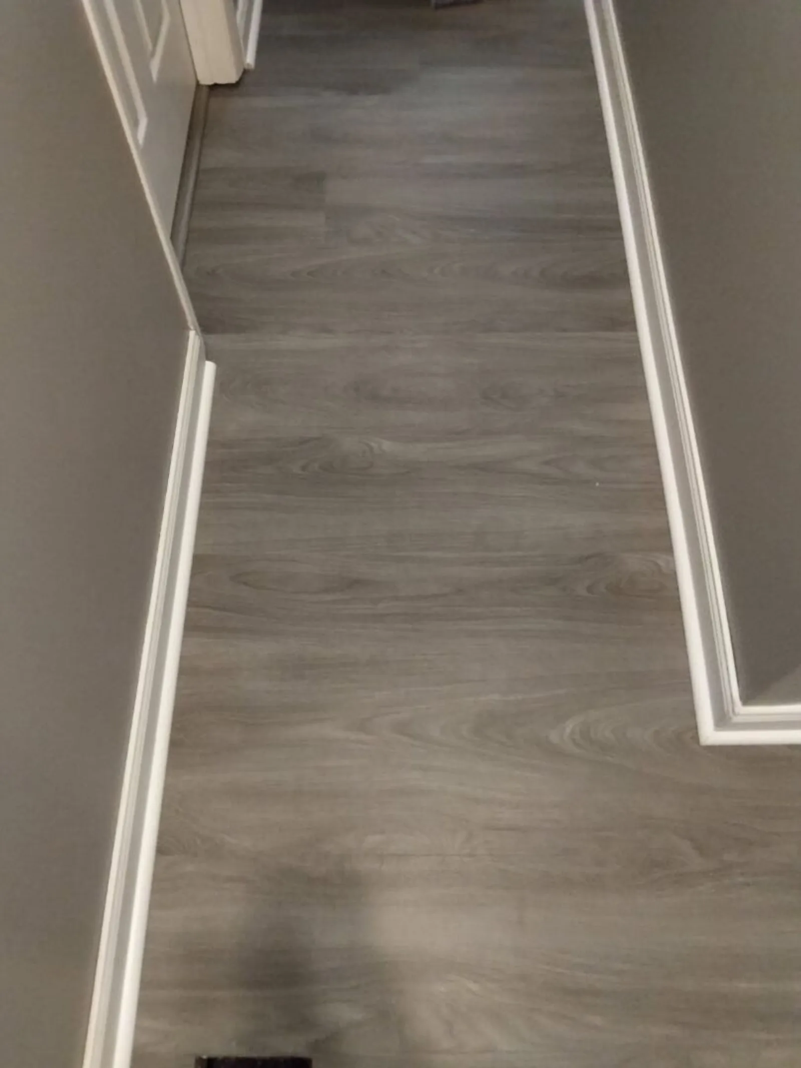Luxury vinyl plank with crisp white trim